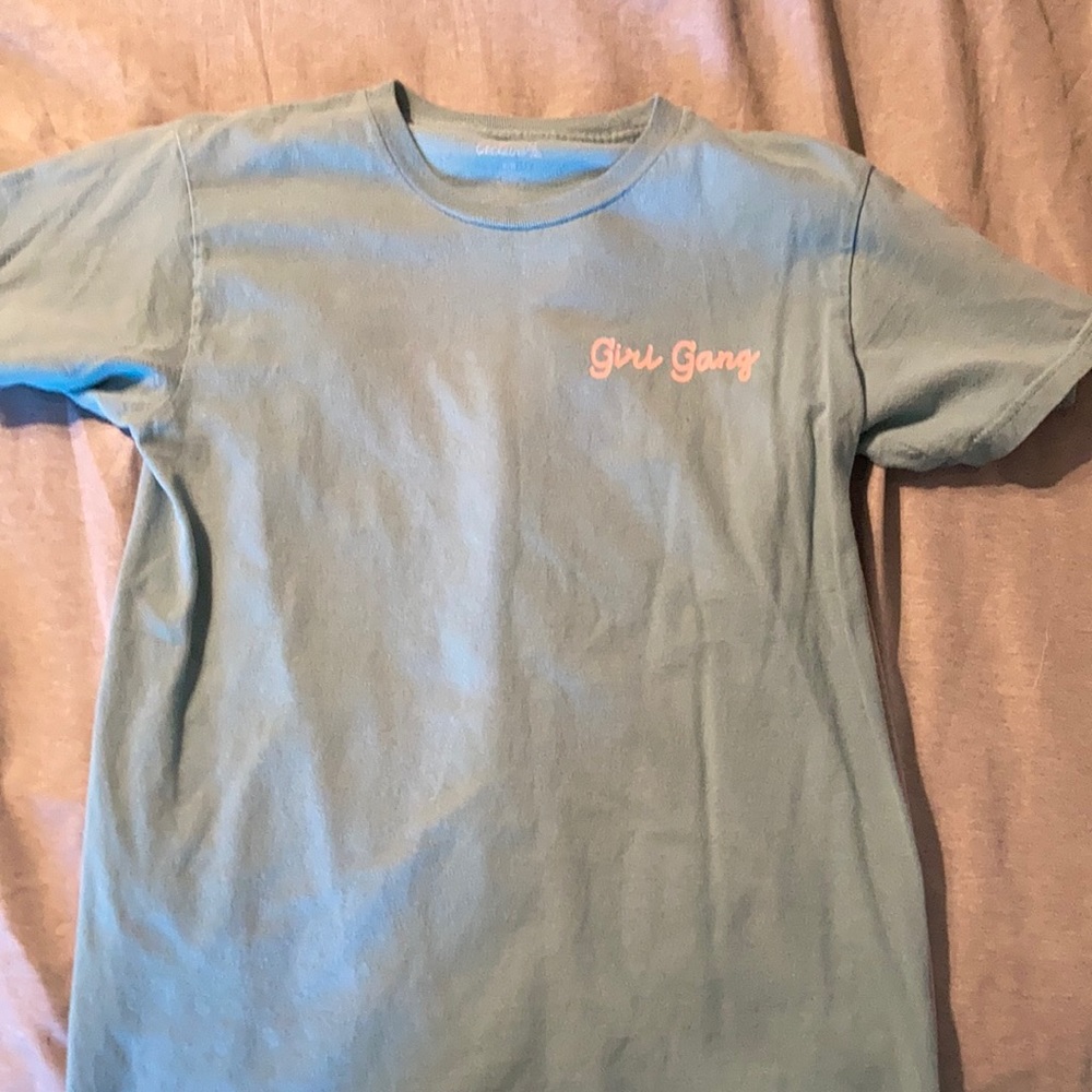 Blue shirt with pink letters